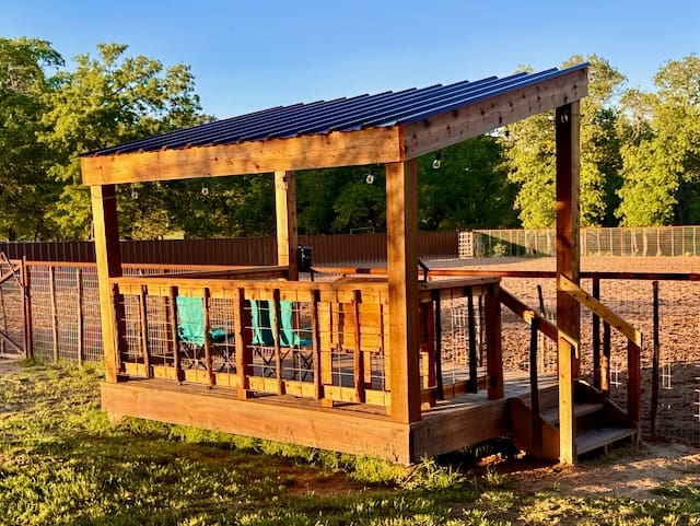 A wooden structure with steps and benches on top of it.