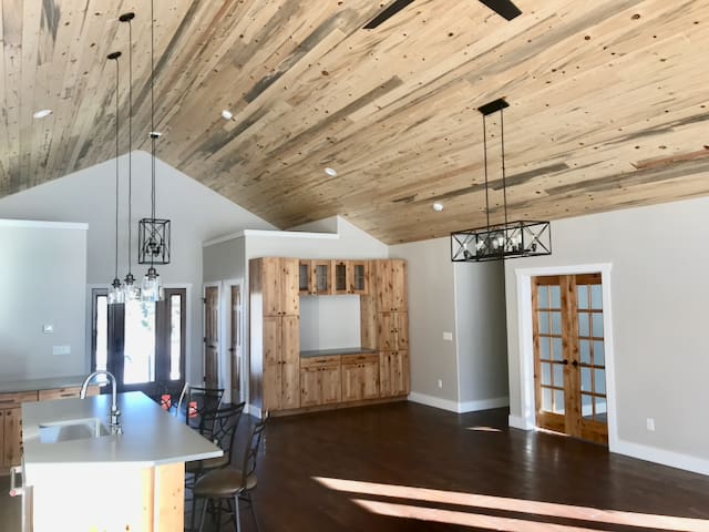 A room with wood paneled walls and ceiling.