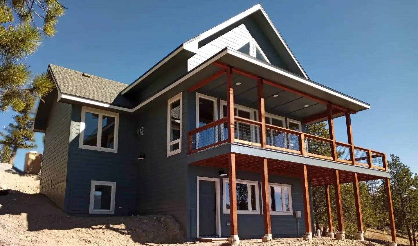 A house with a deck and a porch on the side.